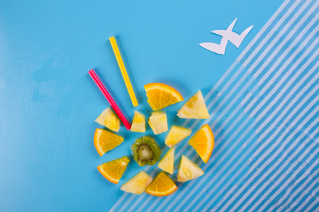 different tropical fruits on the blue backgroundの写真素材