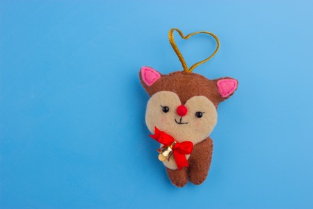 Christmas lovely brown deer on blue backgroundの写真素材