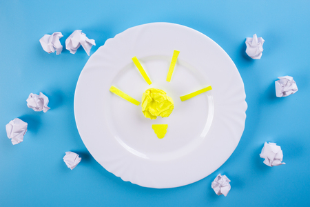 Idea Concepts Light Bulb with Crumpled Paper on Blue backgroundの写真素材