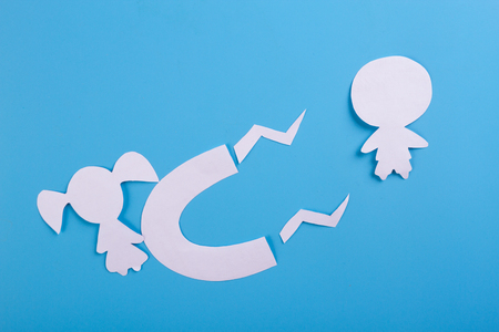 magnet is attracting love on blue backgroundの写真素材