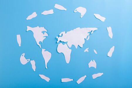 The concept of World Environment Day. world map with plastic bottles
