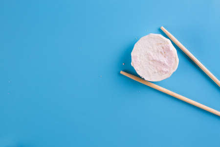Sweet sushi on blue background. Copy spaceの写真素材
