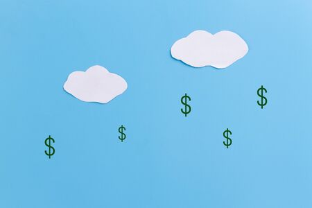 Dollar rain on blue background. Wealth conceptの写真素材