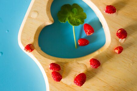 Harvest fresh red wild strawberries texure or background
