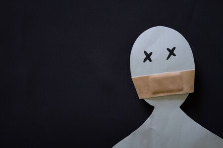 Paper person with shuted mouth. Violence conceptの写真素材