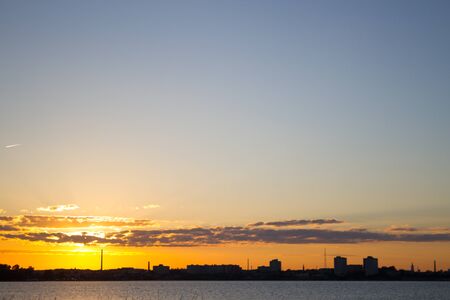 Sunset over calm water. Toned imageの写真素材
