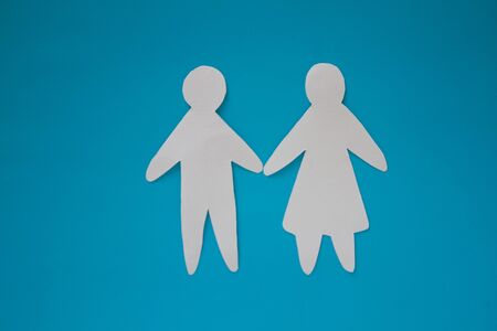 Paper couple on blue background. Love conceptの写真素材