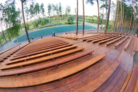 Wooden staduim in forest. Big staduim in parkの写真素材