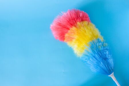 Dust cleaner on blue background with copy space