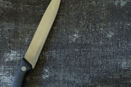Kitchen knife on black background with copy space