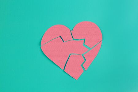 Broken heart concept image. Paper broken heart