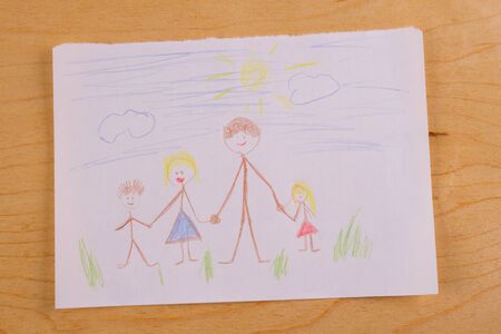 Children's drawing paints with happy family on itの写真素材