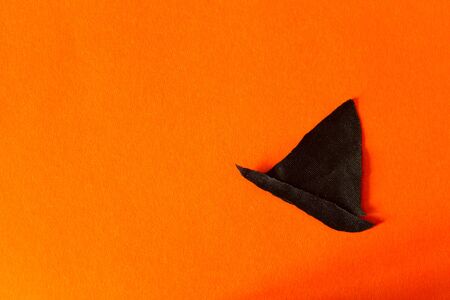 Halloween concept image. Witch hat on orange backgroundの写真素材