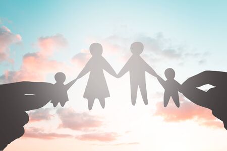 Paper family silhouette over Beautiful clouds on the sky