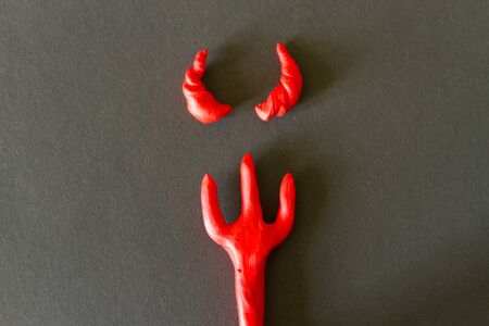 Trident on red background. Halloween concept imageの写真素材