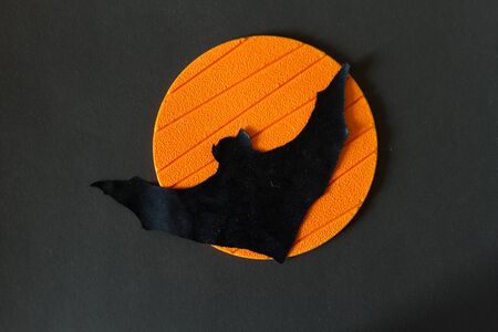 Halloween image concept. Bat on orange background