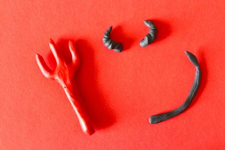 Trident on red background. Halloween concept image