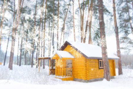 House in winter. Small winter cottage. blurred imageの写真素材