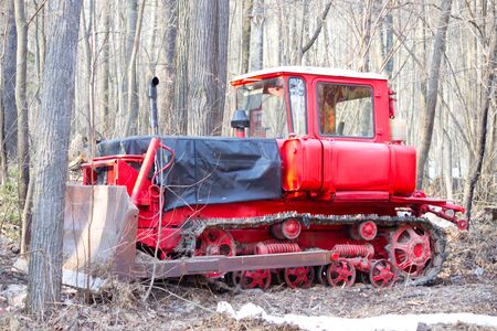Red tractor. Agricultural machinery. Nature side