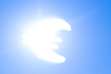 Euro symbol on sky background instead of the sunの写真素材