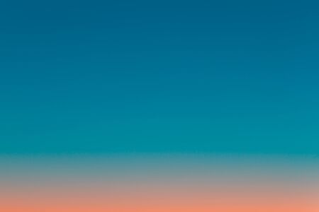 Blurred image of the sunset sky. Gradient from blue to pink