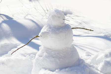 Snowman in bright sunlight. Christmastimeの写真素材
