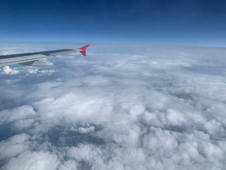 Blue sky view from aircraft windowの写真素材