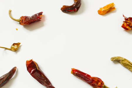 Dry Chilli peppers on white backgroundの写真素材