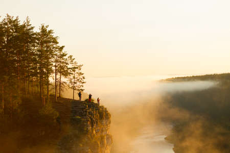 Beautiful foggy sunrise over hillsの写真素材