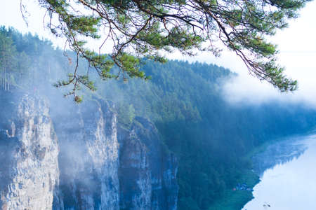 Beautiful foggy sunrise over hillsの写真素材