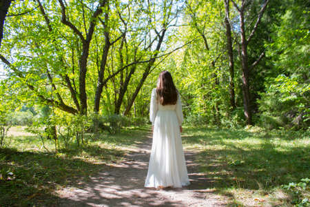 Blurred image of bride in a parkの写真素材