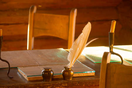 old papers and books on a wooden tableの写真素材