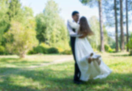 Bride and groom on nature background. Blurredの写真素材