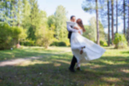 Bride and groom on nature background. Blurredの写真素材