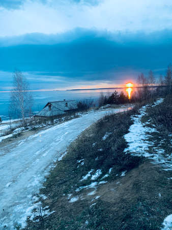 Winter landscape with frozen riverの写真素材