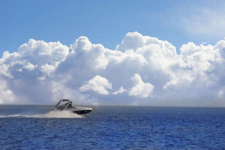 Speed boat on the water going fast. copy space
