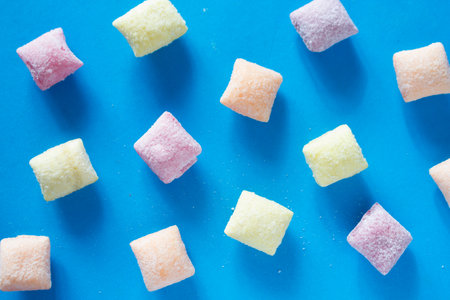 Different candies on blue backgroundの写真素材