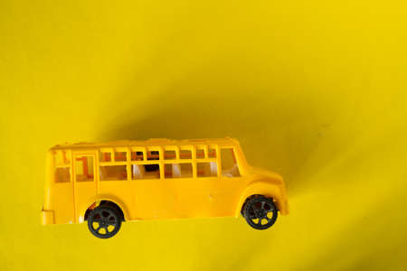 Yellow school bus toy with copy spaceの写真素材