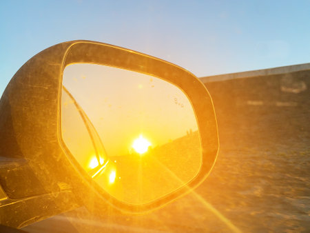 Sun reflection in side mirror of a carの写真素材