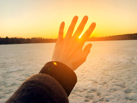 Hand against the sun. hope concept