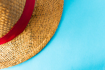 Summer hat on blue backround. copy space