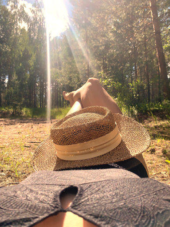 Woman relax on the lake in a forestの写真素材