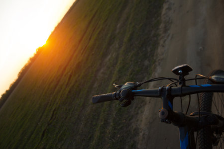 Bycycle in the field. Sunsetの写真素材