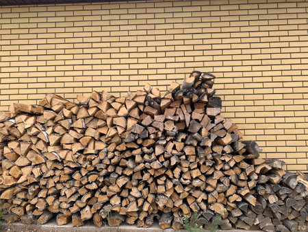 Large pile of a firewood. Near brick houseの写真素材