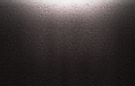 illuminated stone wall light comes from the topの写真素材