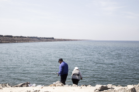 Fishing at the beach sideのeditorial素材