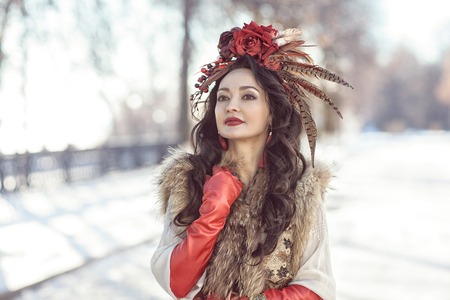 The girl in furs and red clothes. winterの写真素材