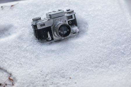 Vintage camera in the snowの写真素材