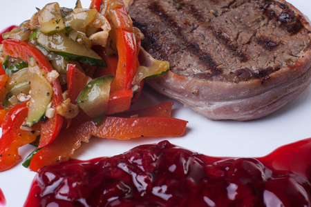 Meat grilled with sauce on white backgroundの写真素材