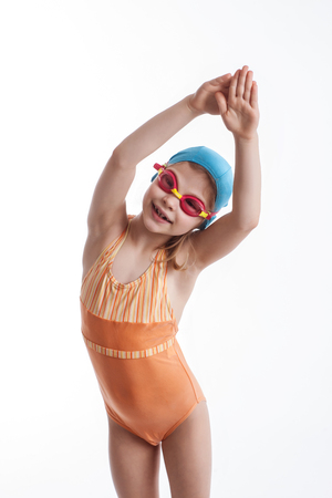 Little girl in a orange swimsuitの写真素材